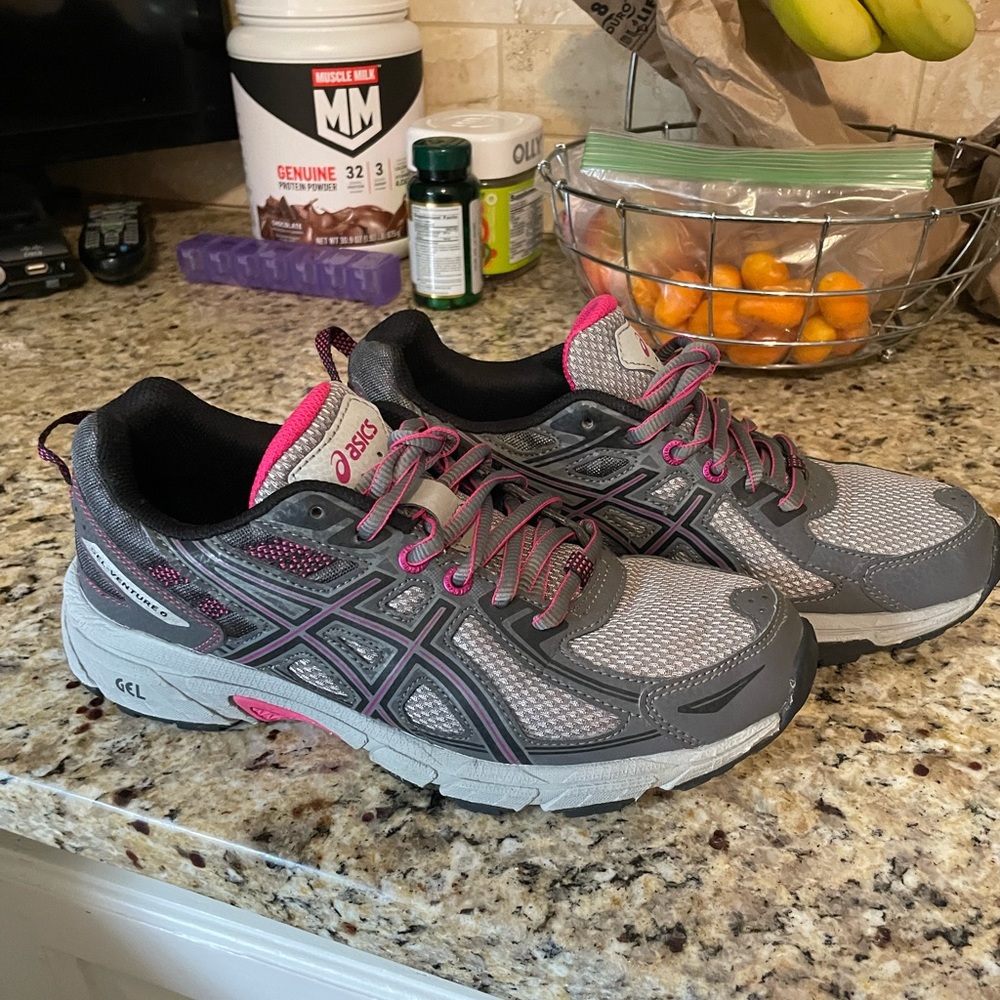 Size 7 women’s ASICS.  Grey and pink .  Like new